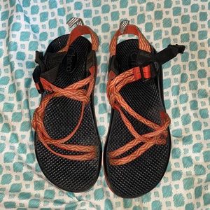 re, orange, and yellow chacos